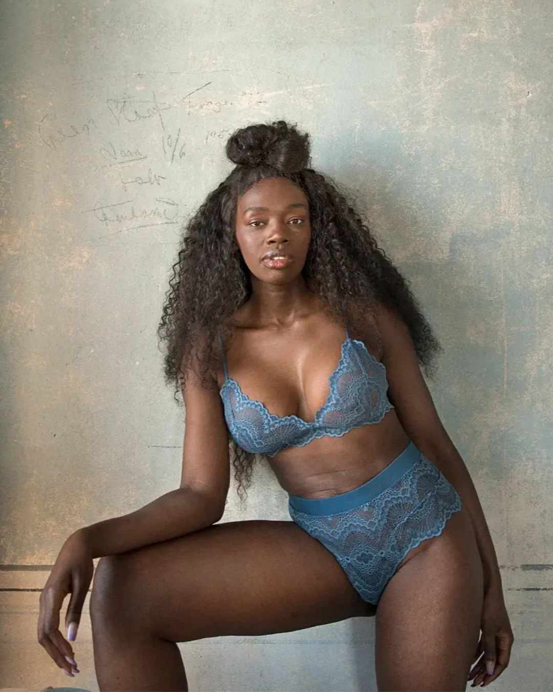 Blue lace lingerie portrait — Understatement source Adult model wearing blue lace lingerie in a relaxed editorial pose, illustrating online creator image exposure