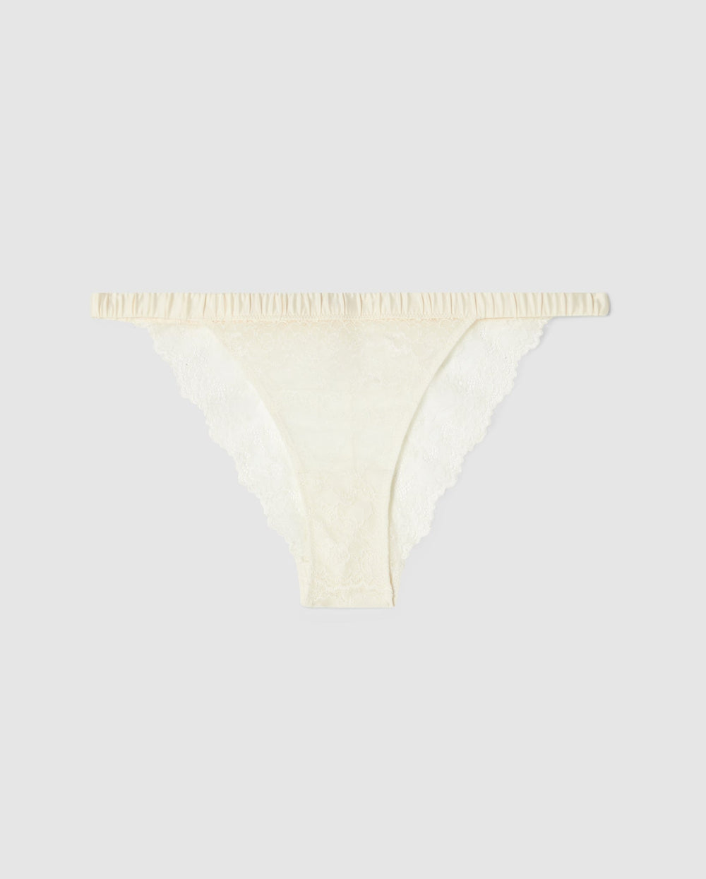 An lace satin bikini tanga in cream.